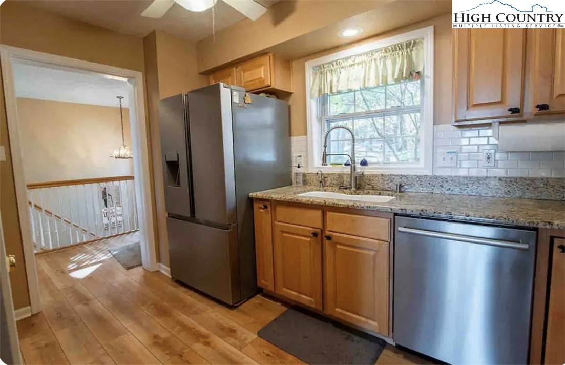 304 St Andrews Road Beech Mountain, NC 28604 - Photo 22 of 33 a kitchen with stainless steel appliances granite countertop a refrigerator and a sink