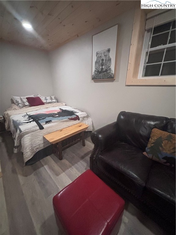 304 St Andrews Road Beech Mountain, NC 28604 - Photo 29 of 33 a bedroom with a bed and window