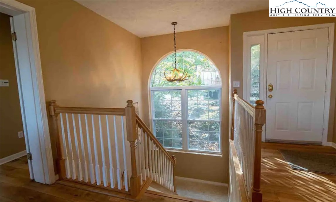 304 St Andrews Road Beech Mountain, NC 28604 - Photo 31 of 33 a view of hallway with a door and wooden floor