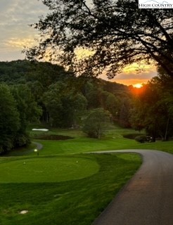 304 St Andrews Road Beech Mountain, NC 28604 - Photo 6 of 33 a view of a golf course with a lake