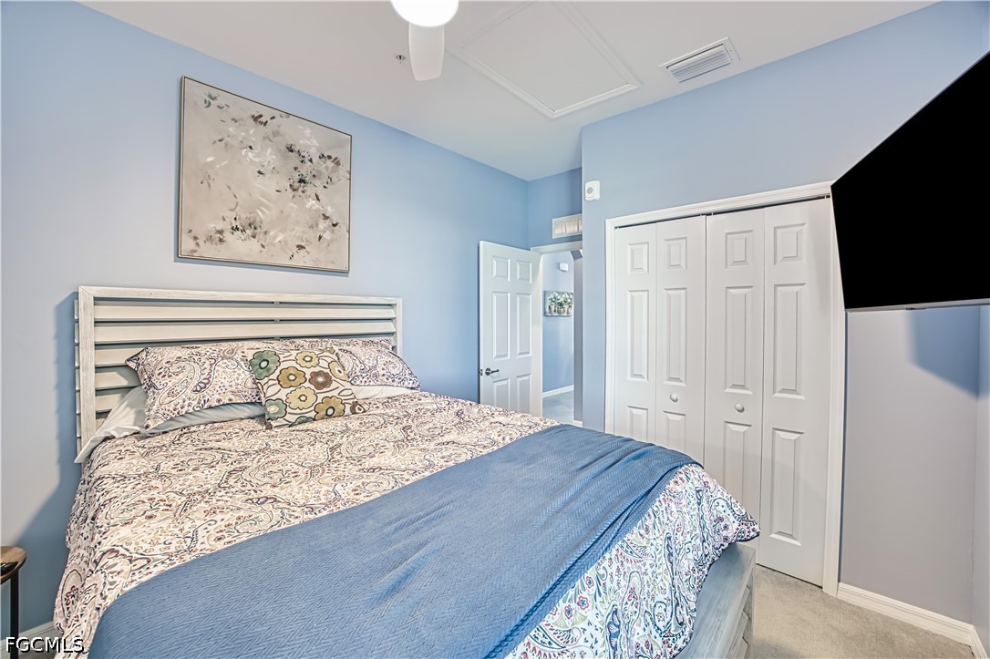 43993 Boardwalk Loop, Unit 1941 Punta Gorda, FL 33982 - Photo 11 of 36 a bedroom with a bed and a flat screen tv