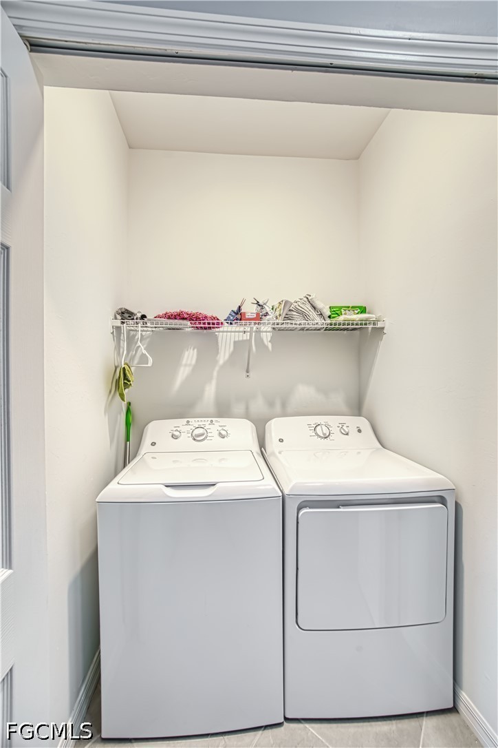 43993 Boardwalk Loop, Unit 1941 Punta Gorda, FL 33982 - Photo 12 of 36 a utility room with dryer and washer