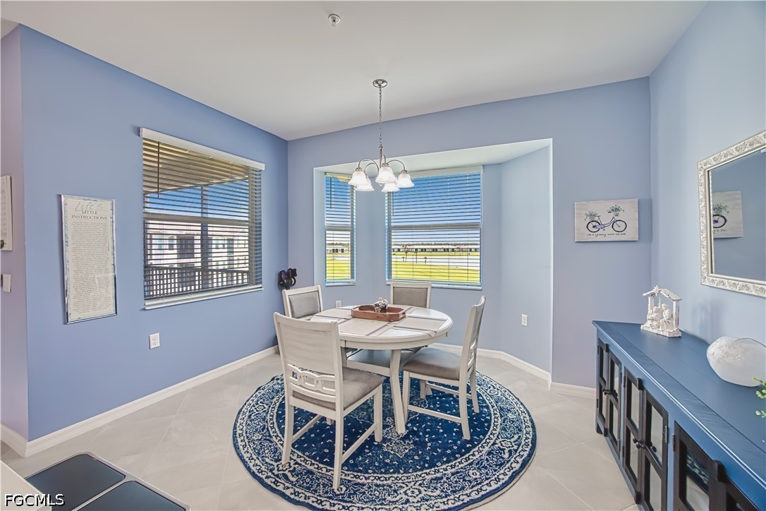 43993 Boardwalk Loop, Unit 1941 Punta Gorda, FL 33982 - Photo 17 of 36 a dining room with furniture and window