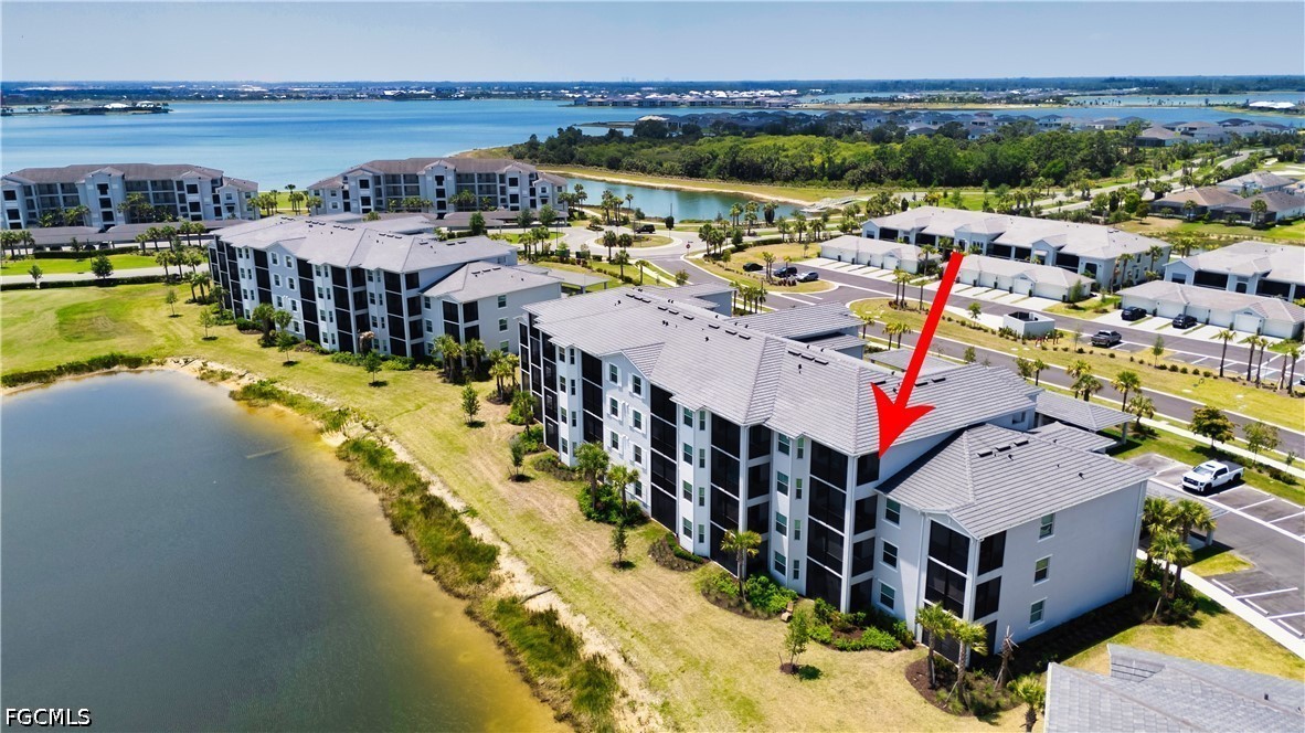 43993 Boardwalk Loop, Unit 1941 Punta Gorda, FL 33982 - Photo 23 of 36 a view of a swimming pool with an ocean view