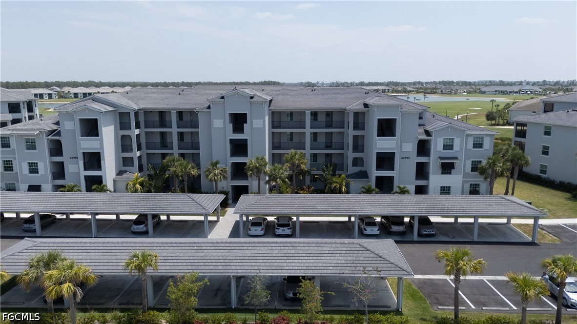 43993 Boardwalk Loop, Unit 1941 Punta Gorda, FL 33982 - Photo 25 of 36 a view of a swimming pool with seating space
