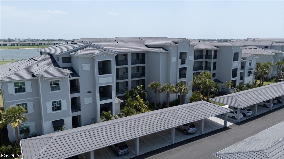 43993 Boardwalk Loop, Unit 1941 Punta Gorda, FL 33982 - Photo 26 of 36 a view of a patio with table and chairs and potted plants