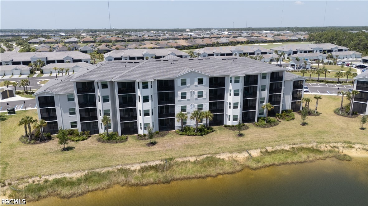 43993 Boardwalk Loop, Unit 1941 Punta Gorda, FL 33982 - Photo 31 of 36 a front view of a building with a outdoor space