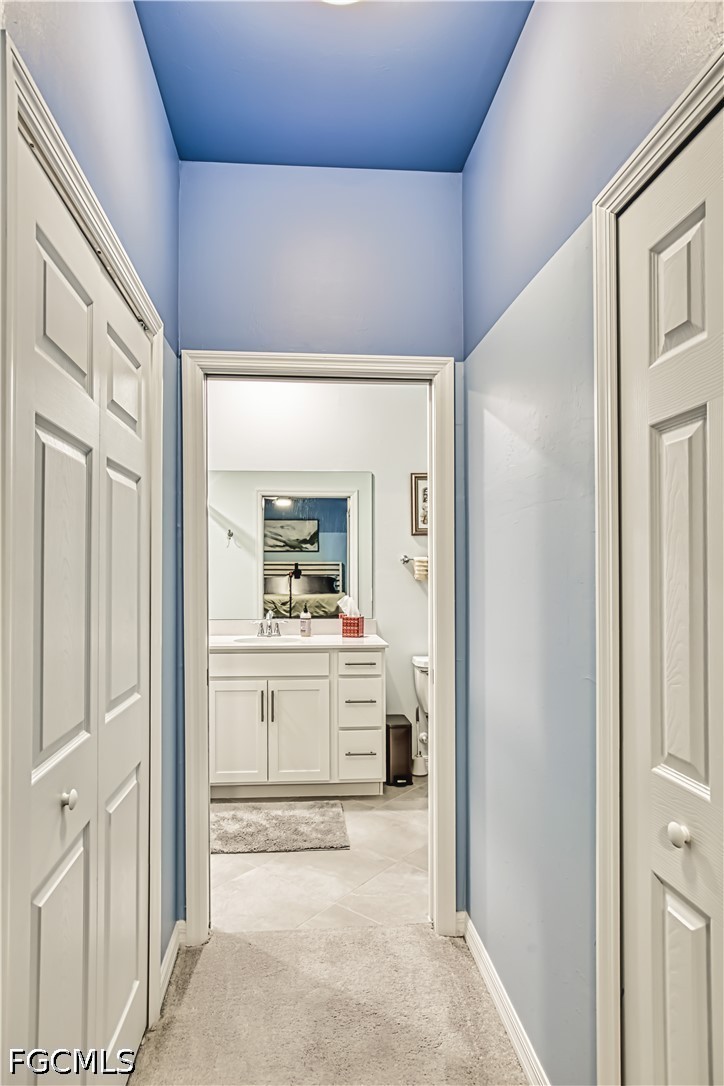 43993 Boardwalk Loop, Unit 1941 Punta Gorda, FL 33982 - Photo 5 of 36 a view of a hallway to rooms and kitchen