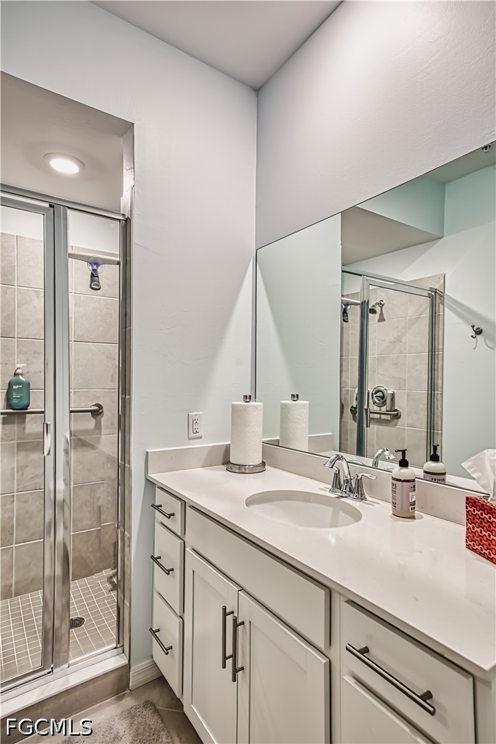 43993 Boardwalk Loop, Unit 1941 Punta Gorda, FL 33982 - Photo 6 of 36 a bathroom with a sink and a mirror