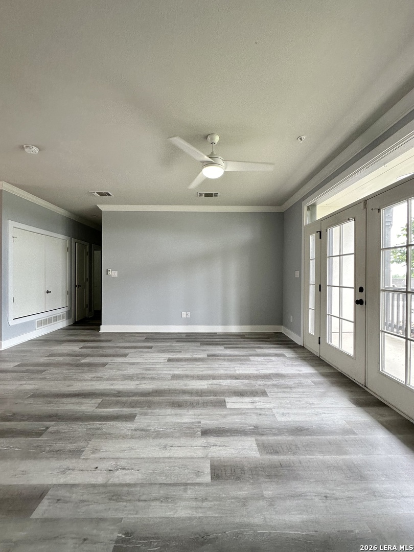 831 Terrell Road, Unit 103 San Antonio, TX 78209 - Photo 3 of 8 a view of an empty room with a window