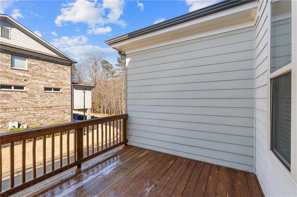 1002 Township Square Alpharetta, GA 30022 - Photo 20 of 42 a view of a balcony with wooden floor