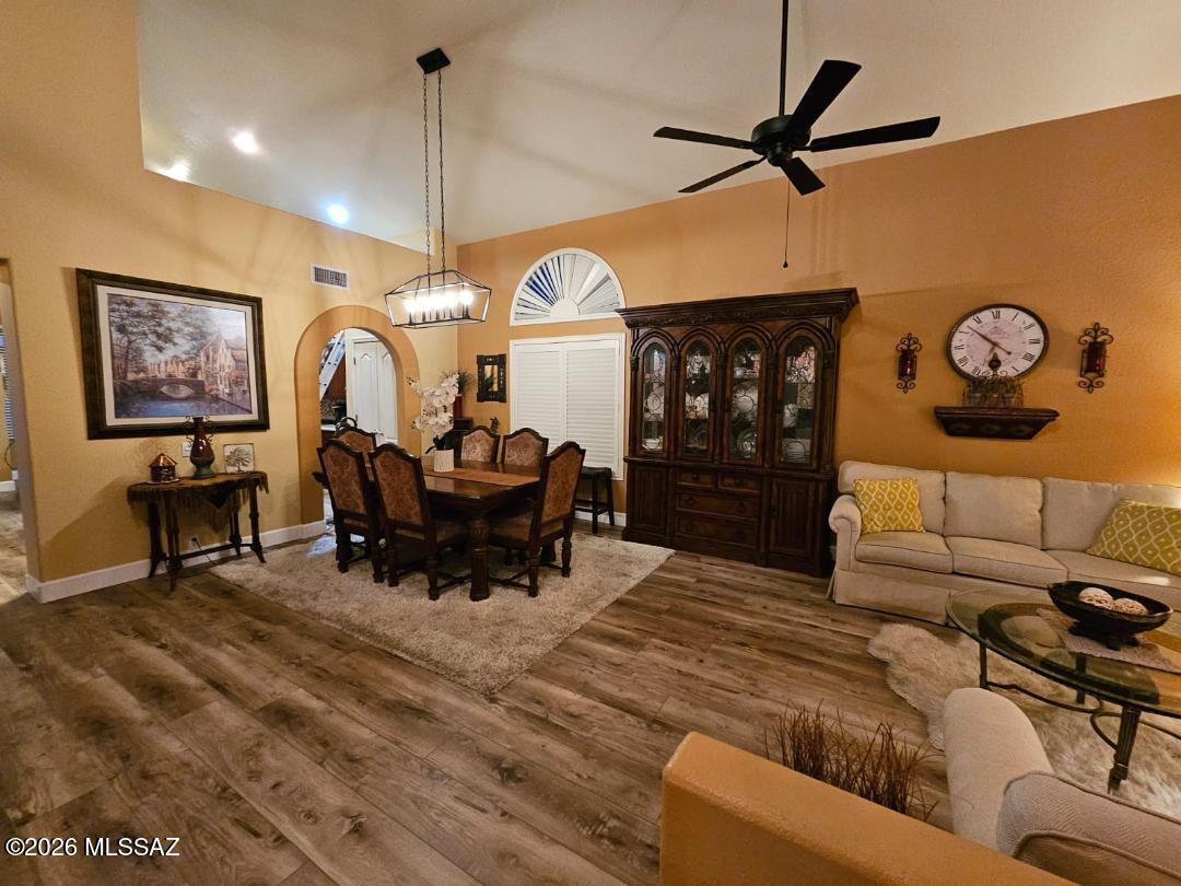 3130 West Star Ranch Trail Tucson, AZ 85742 - Photo 7 of 44 a living room with furniture a window and a clock