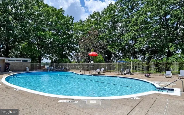 a view of a swimming pool with a sitting space