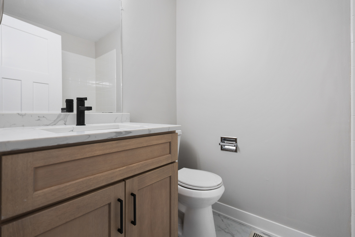 1066 Glouchester Harbor, Unit 1066 Schaumburg, IL 60193 - Photo 17 of 26 a bathroom with a toilet a sink and mirror