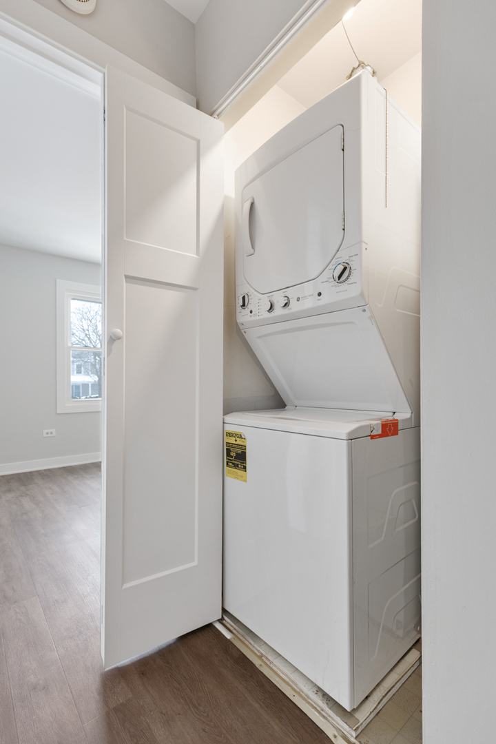 1066 Glouchester Harbor, Unit 1066 Schaumburg, IL 60193 - Photo 21 of 26 a utility room with cabinets washer and dryer