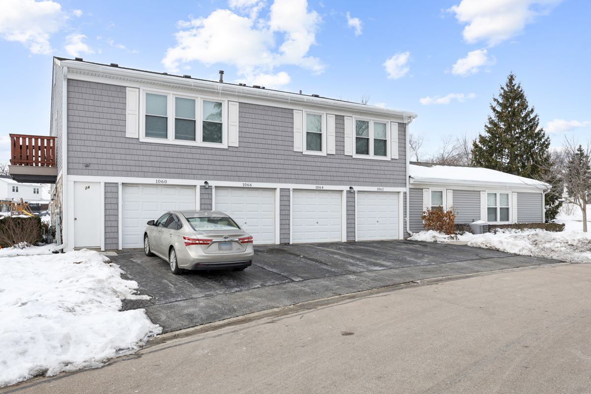 1066 Glouchester Harbor, Unit 1066 Schaumburg, IL 60193 - Photo 25 of 26 a view of a car parked in front of a building