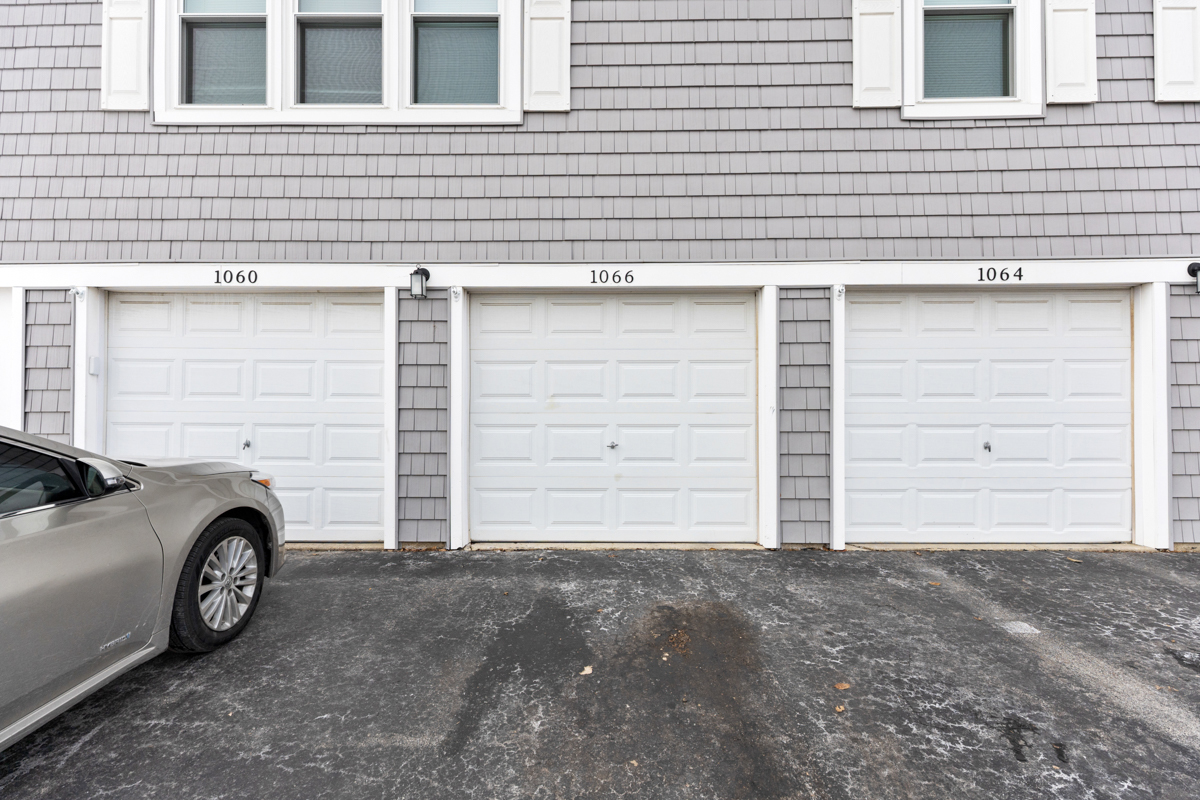1066 Glouchester Harbor, Unit 1066 Schaumburg, IL 60193 - Photo 26 of 26 a front view of a house with parking space