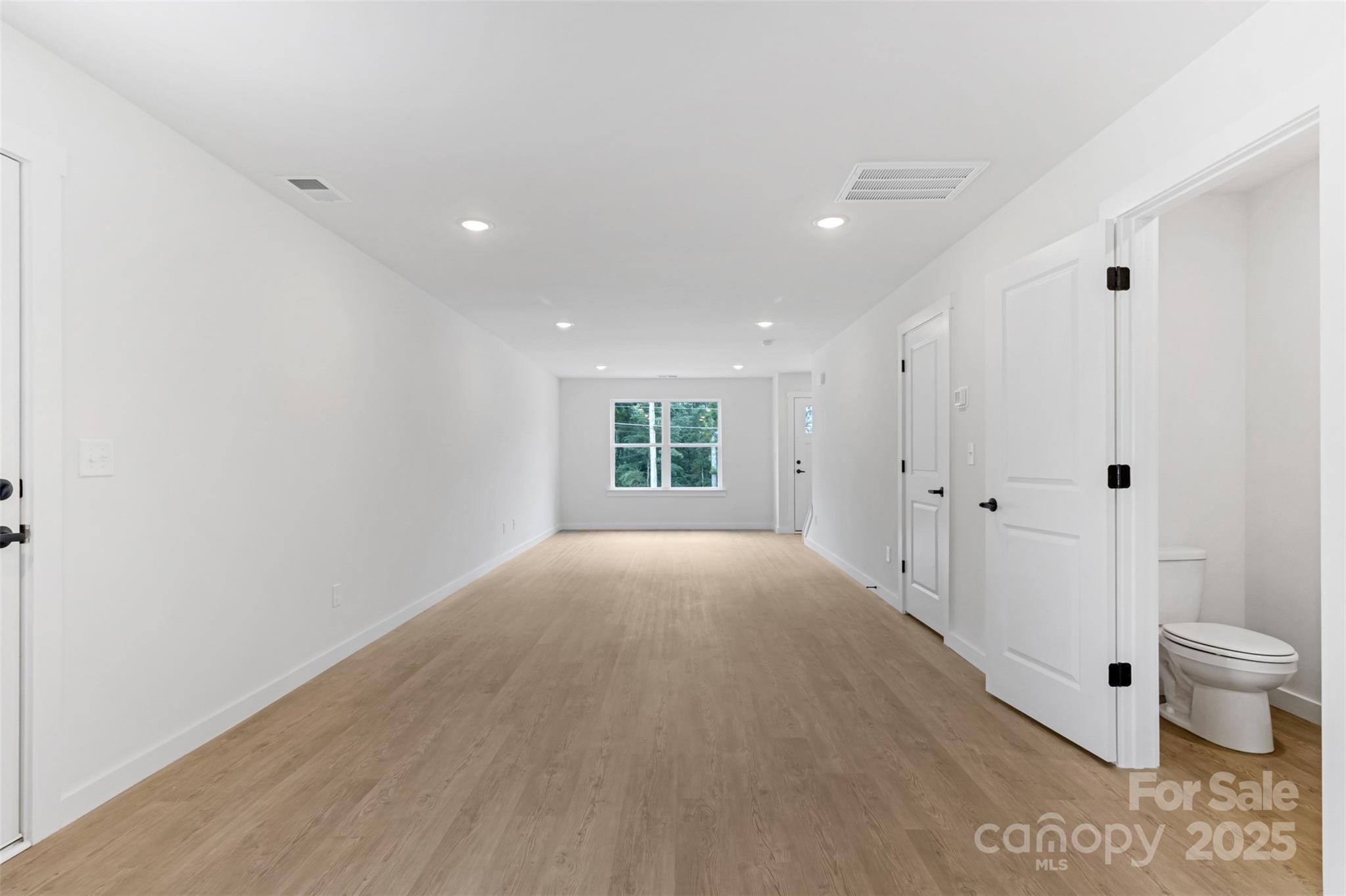 21 8th Ave Drive Southeast, Unit 5 Hickory, NC 28602 - Photo 4 of 14 a view of a big room with wooden floor and windows