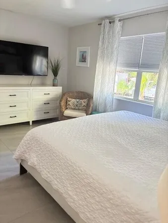 a bedroom with a bed and a couch