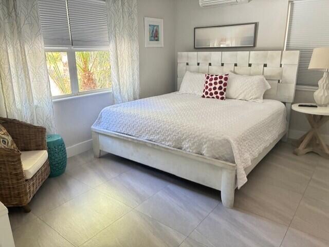 3414 Spring Street Pompano Beach, FL 33062 - Photo 12 of 14 a bedroom with a bed and a couch