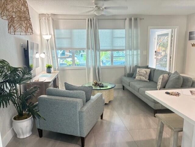 3414 Spring Street Pompano Beach, FL 33062 - Photo 3 of 14 a living room with furniture and a large window