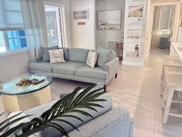 a living room with furniture and a rug