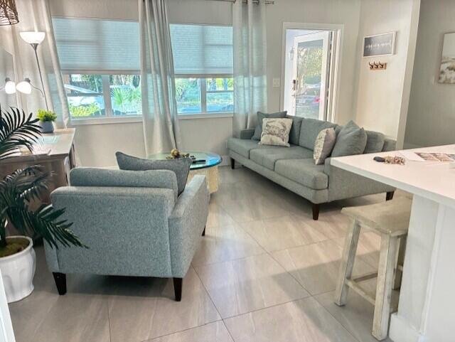 3414 Spring Street Pompano Beach, FL 33062 - Photo 5 of 14 a living room with furniture and a large window