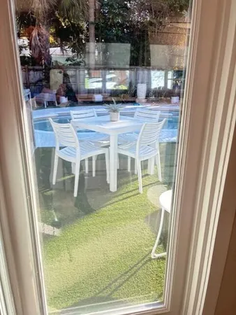 a living room with furniture a dining table and kitchen view