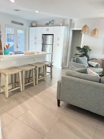 a view of a kitchen with furniture and window