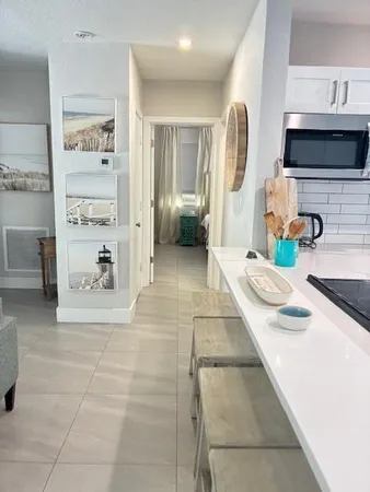 a bedroom with a bed and flat screen tv