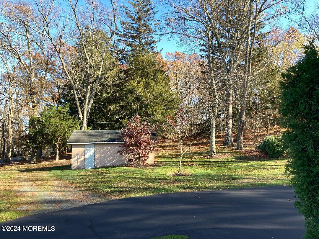 103 Taylors Mills Road Manalapan, NJ 07726 - Photo 25 of 34 Side View with 3rd garage