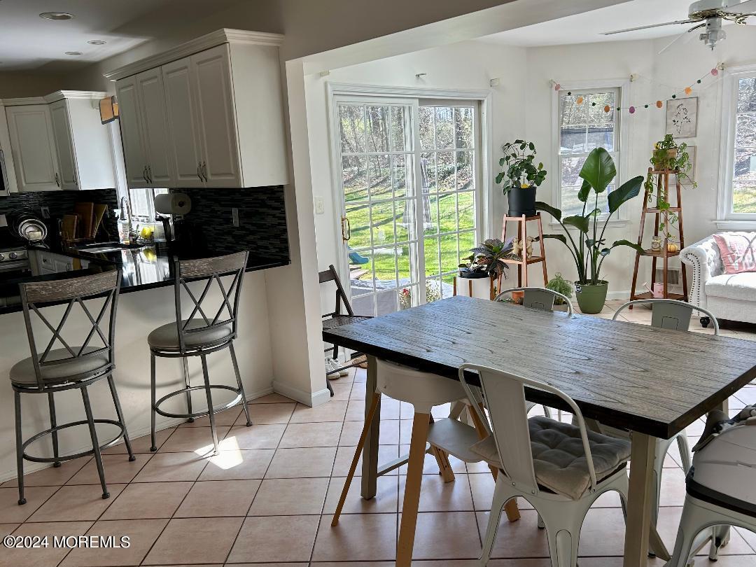 103 Taylors Mills Road Manalapan, NJ 07726 - Photo 7 of 34 Kitchen w sunroom