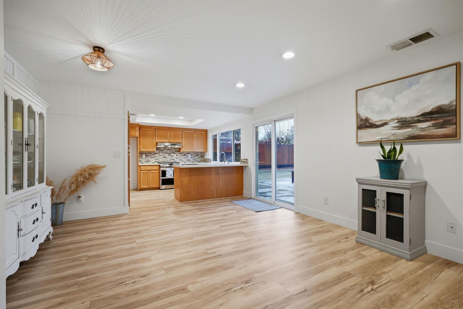 5932 Angelo Drive Loomis, CA 95650 - Photo 11 of 32 a living room with furniture and a kitchen view