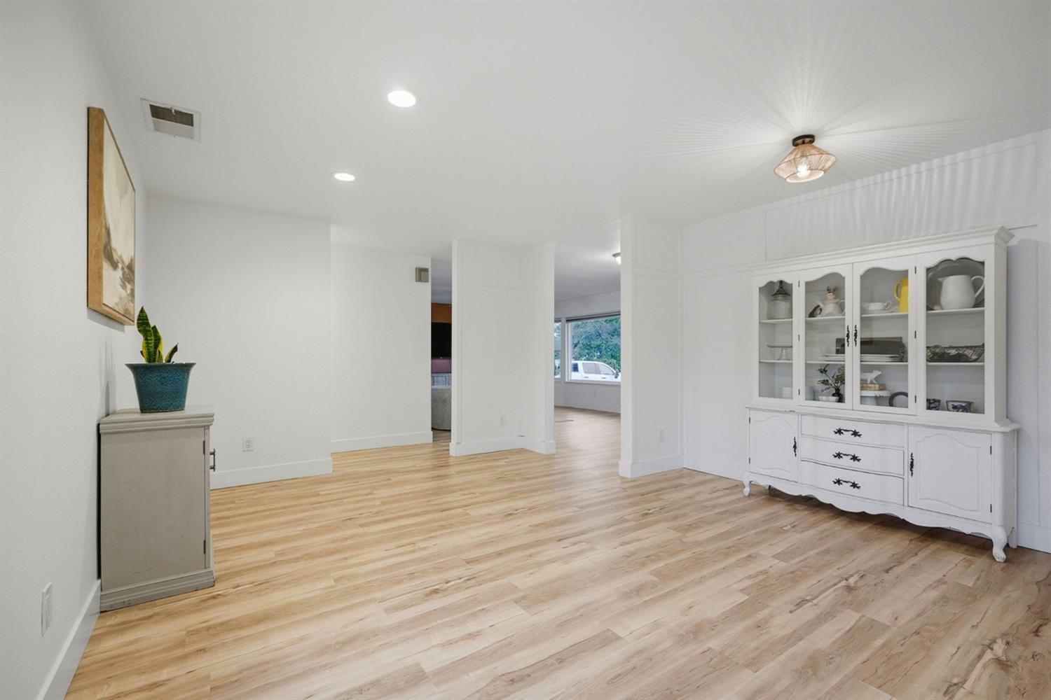 5932 Angelo Drive Loomis, CA 95650 - Photo 12 of 32 a view of an empty room with wooden floor and a window