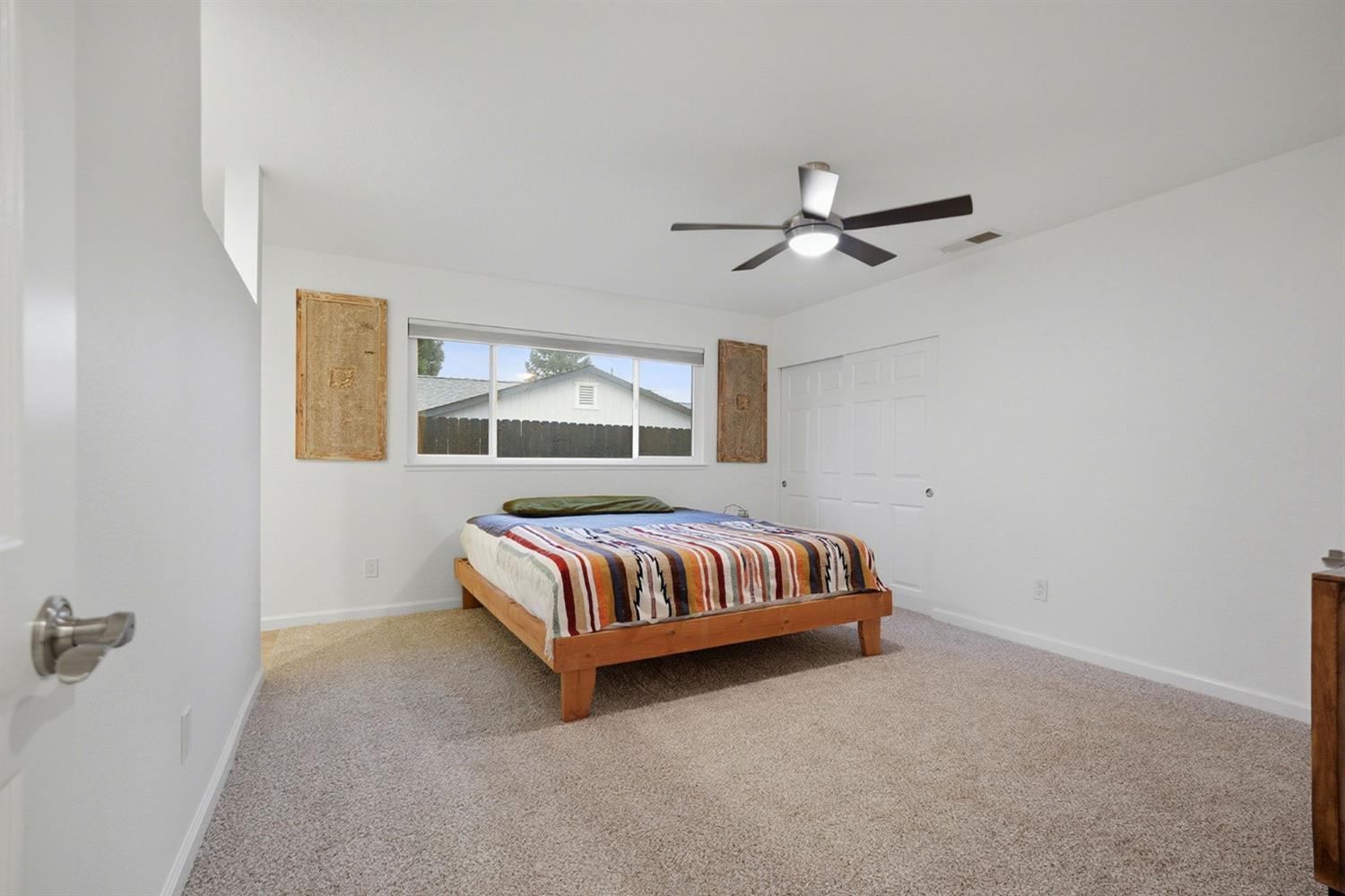 5932 Angelo Drive Loomis, CA 95650 - Photo 17 of 32 a bedroom with a bed and window