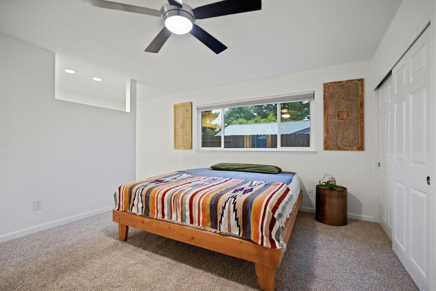 5932 Angelo Drive Loomis, CA 95650 - Photo 18 of 32 a bedroom with a bed and ceiling fan