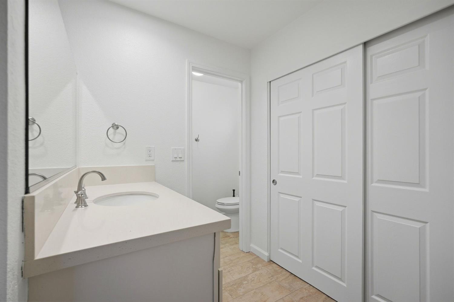 5932 Angelo Drive Loomis, CA 95650 - Photo 19 of 32 a bathroom with a sink and a mirror
