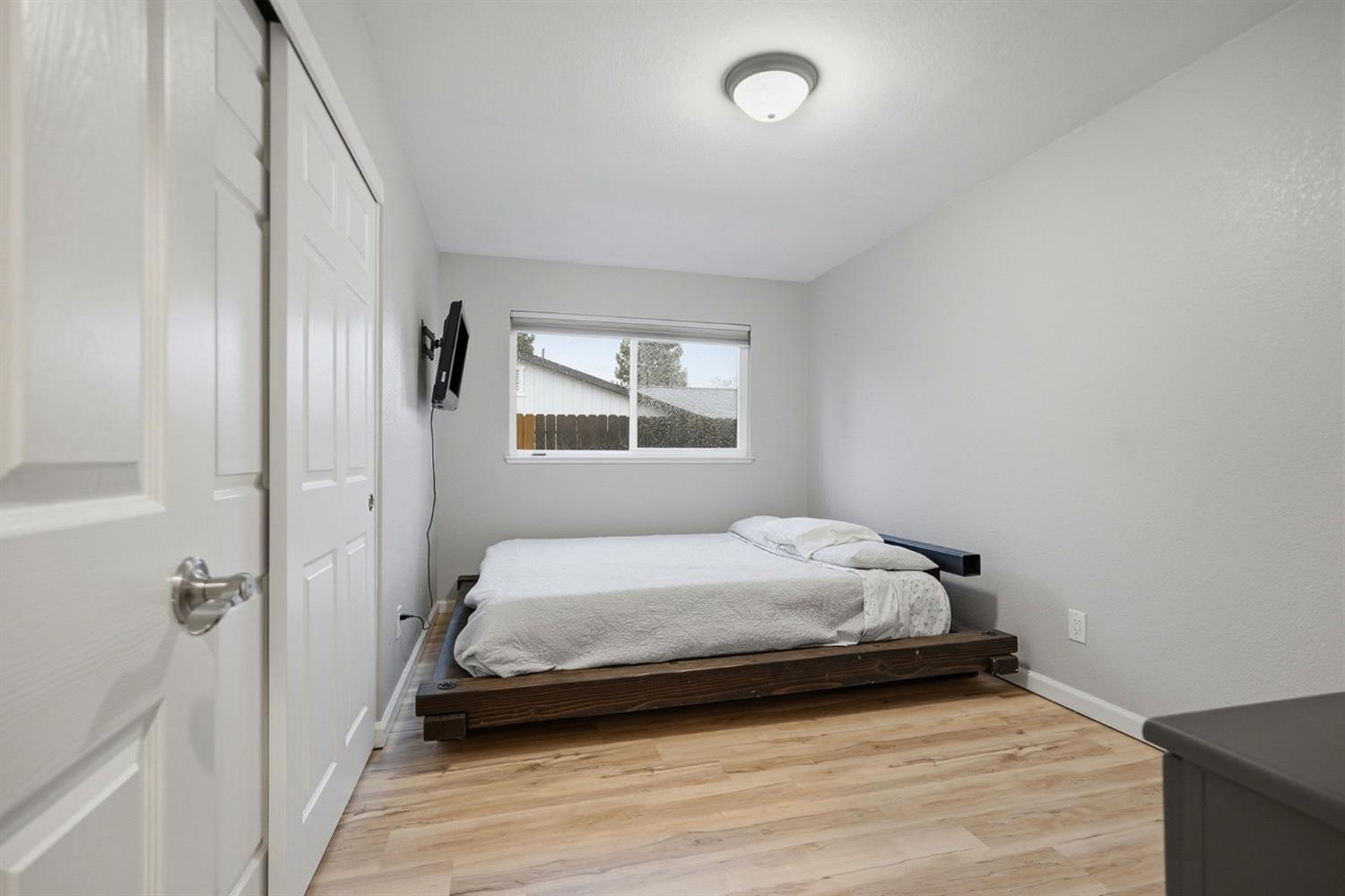 5932 Angelo Drive Loomis, CA 95650 - Photo 21 of 32 a bedroom with a bed and window