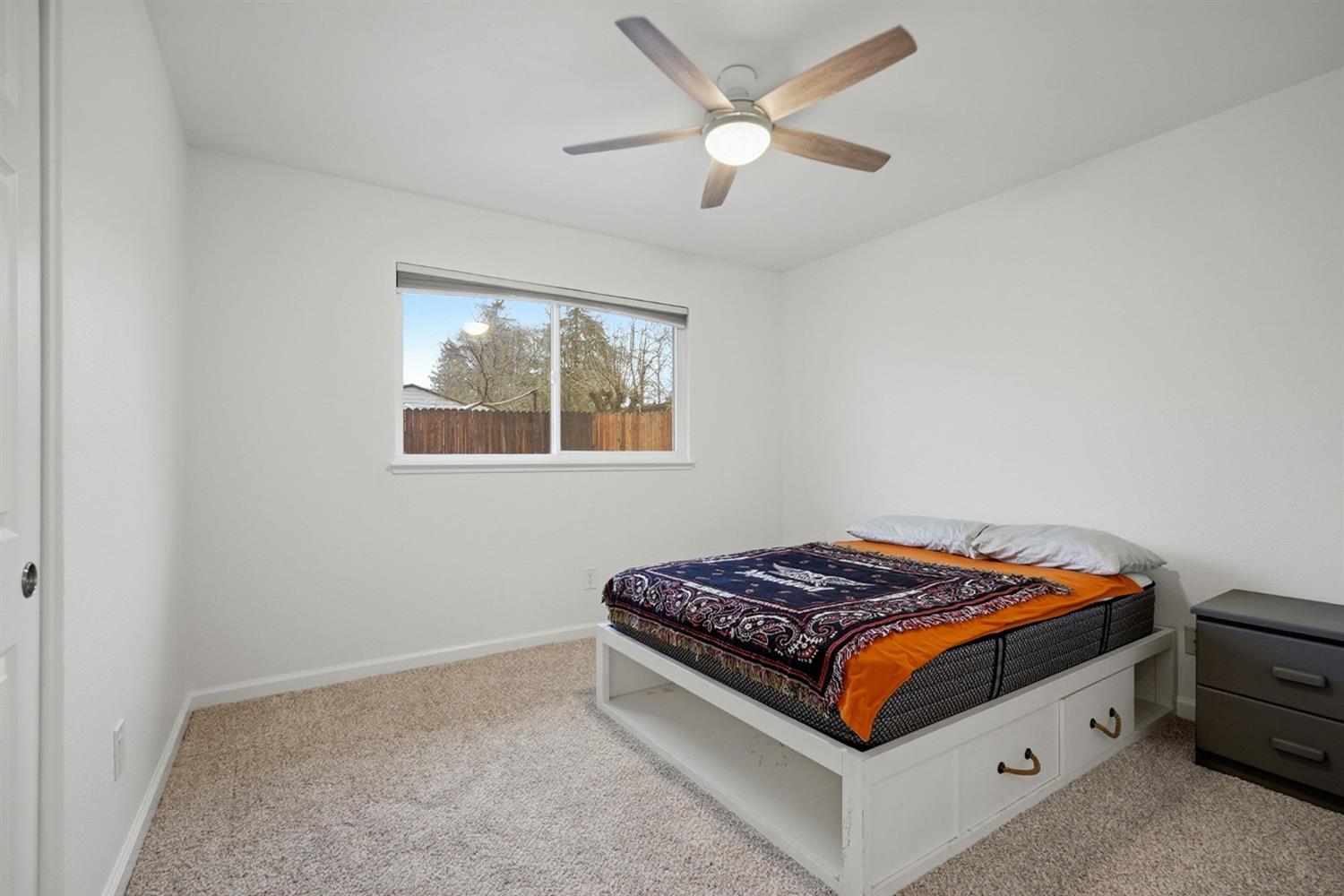 5932 Angelo Drive Loomis, CA 95650 - Photo 25 of 32 a bed sitting in a bedroom next to a window