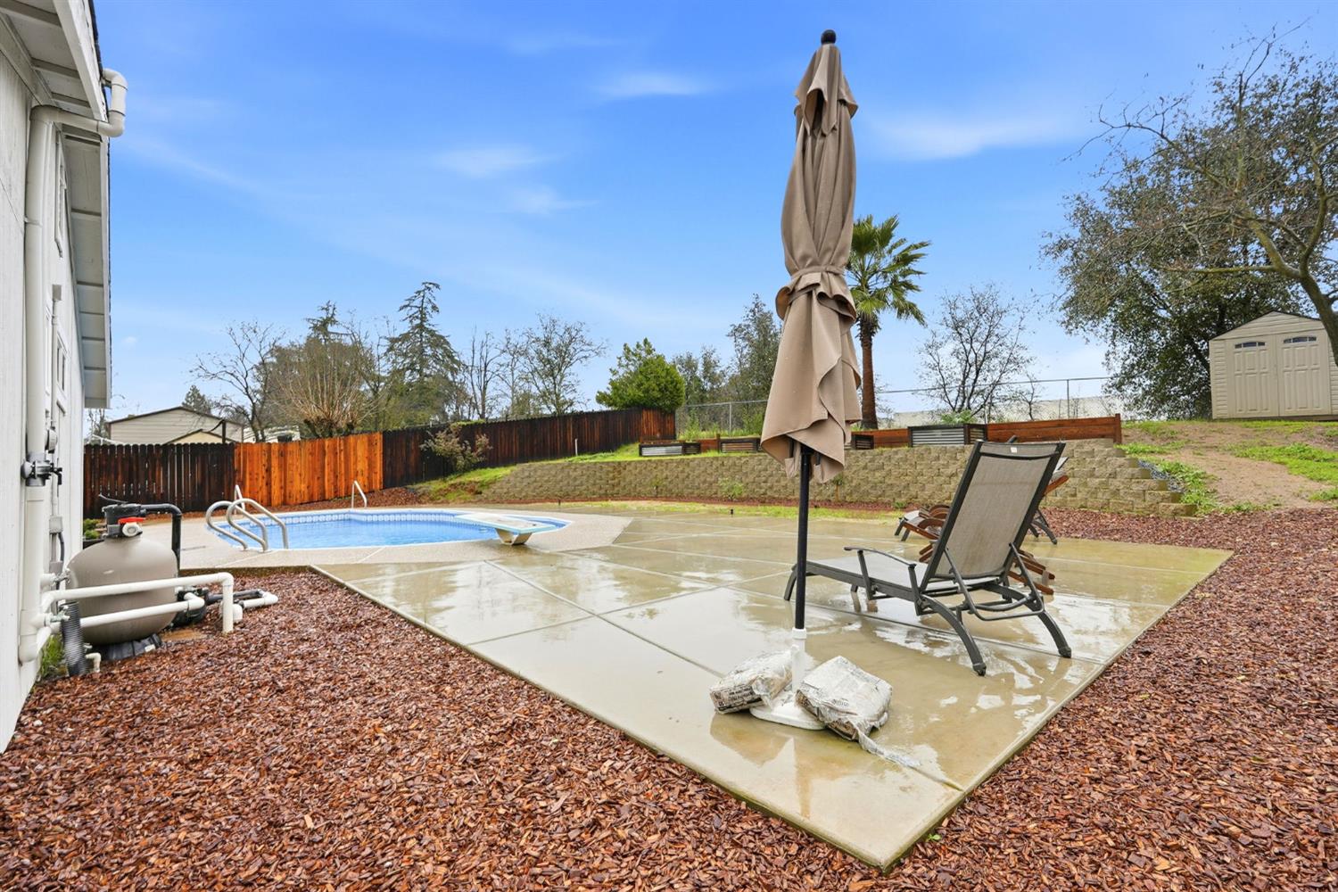 5932 Angelo Drive Loomis, CA 95650 - Photo 31 of 32 a view of a swimming pool with chair and tables