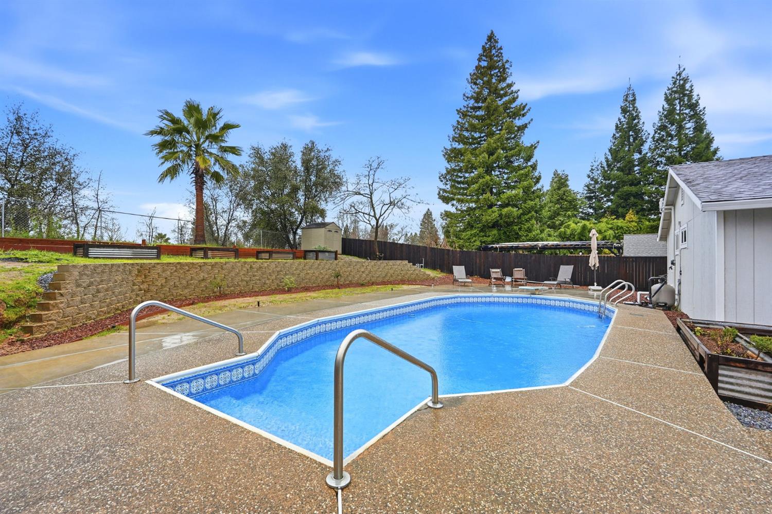 5932 Angelo Drive Loomis, CA 95650 - Photo 4 of 32 a view of a swimming pool with a lounge chairs