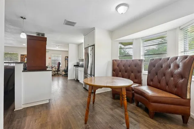 a living room with furniture and a table