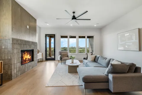 a living room with furniture and a fireplace