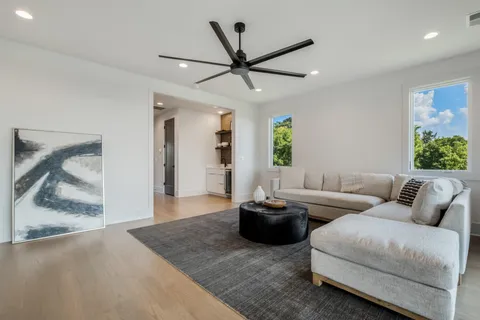a living room with furniture and a rug