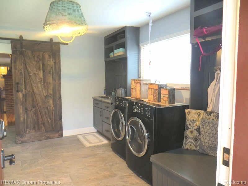7095 Colonial Way Howell, MI 48855 - Photo 43 of 61 new laundry.jpg