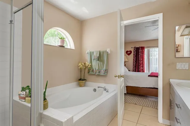 a bathroom with a bathtub and a sink