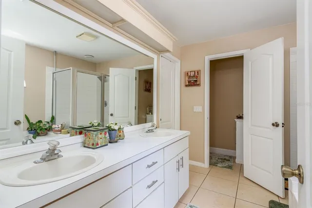 a bathroom with a double vanity sink mirror and double