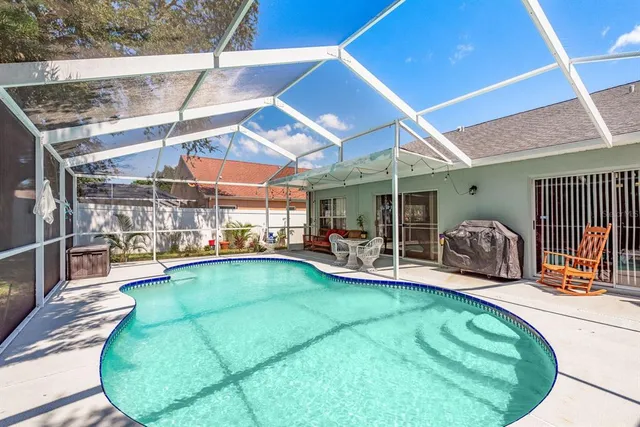 a view of a swimming pool with a patio