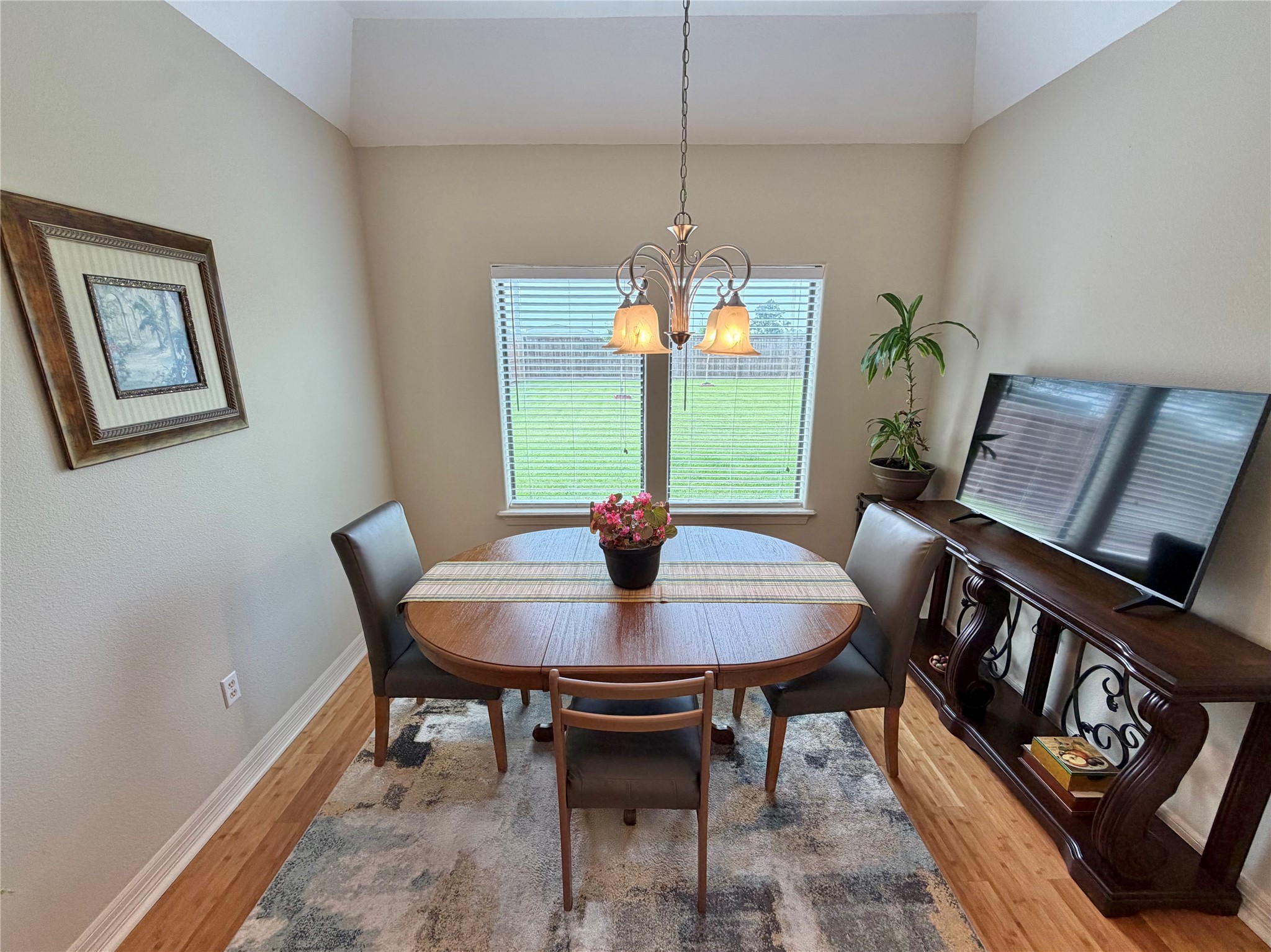 1448 South Blue Bonnet Lane Angleton, TX 77515 - Photo 14 of 43 a view of a dining room with furniture window and wooden floor