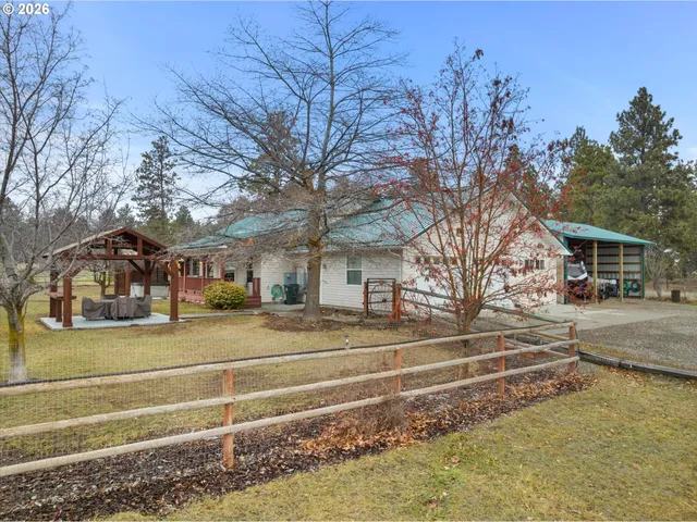 a view of a city street and trees